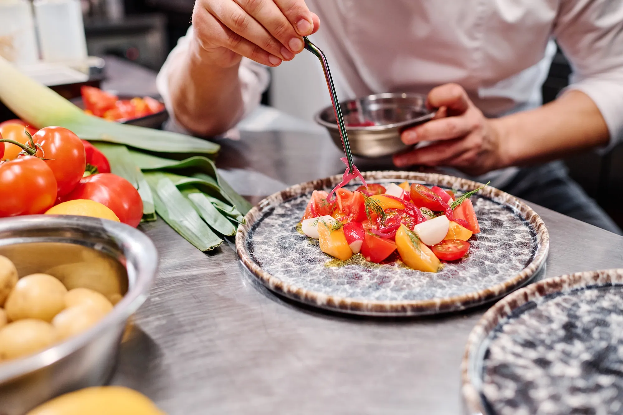 chef-decorating-dish-with-vegetables